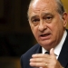 Spain's Interior Minister Jorge Fernandez Diaz delivers a speech during a debate of the Spanish government's new security law, known as "Ley Mordaza" ("Gag Law"), at Parliament in Madrid March 26, 2015. The bill has been approved by the conservative-led Spanish parliament today, despite heavy opposition from some politicians and activist groups, who say the law violates the right to protest, limits freedom of expression and gives more power to police. REUTERS/Juan Medina - RTR4V1BU