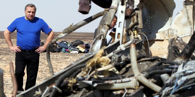 Russian Emergencies Minister Vladimir Puchkov looks at debris from a Russian airliner at its crash site at the Hassana area in Arish city, north Egypt, November 1, 2015. Russia has grounded Airbus A321 jets flown by the Kogalymavia airline, Interfax news agency reported on Sunday, after one of its fleet crashed in Egypt's Sinai Peninsula, killing all 224 people on board. REUTERS/Mohamed Abd El Ghany - RTX1U8KZ