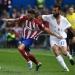 Atletico Madrid's Yannick Carrasco (L) is challenged by  Real Madrid's Alvaro Arbeloa during their Spanish first division derby soccer match at the Vicente Calderon stadium in Madrid, Spain, October 4, 2015.   REUTERS/Andrea Comas  - RTS30DF