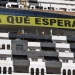 Greenpeace activists stand under a banner reading "What are they waiting for?" in reference to the demolition of a hotel, after they occupied the construction site in El Algarrobico beach in Carboneras, southeastern Spain, September 5, 2011. Greenpeace say the construction of the hotel was ruled illegal due to a coastal protection law and Greenpeace members occupied an area of the construction site to demand the local government the immediate demolition of the building. REUTERS/Francisco Bonilla (SPAIN - Tags: ENVIRONMENT CIVIL UNREST BUSINESS CONSTRUCTION) - RTR2QTM7