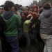 Stranded refugees and migrants are pushed back by Greek riot police after they tried to storm Macedonia from the Greek side of the border during a protest, near the Greek village of Idomeni, February 29, 2016. Macedonian police fired tear gas to disperse hundreds of migrants and refugees who stormed the border from Greece on Monday, tearing down a gate as frustrations boiled over at restrictions imposed on people moving through the Balkans. REUTERS/Alexandros Avramidis - RTS8KG4