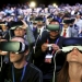 People wear Samsung Gear VR devices as they attend the launching ceremony of the new Samsung S7 and S7 edge smartphones during the Mobile World Congress in Barcelona, Spain, February 21, 2016. REUTERS/Albert Gea      TPX IMAGES OF THE DAY      - RTX27XXM