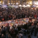 People attend a street memorial service near the old stock exchange in Brussels following Tuesday's bomb attacks in Brussels, Belgium, March 23, 2016.     REUTERS/Vincent Kessler - RTSBY63