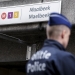 A Belgian police officer stands guard outside the metro station of Maalbeek in Brussels following bomb attacks in Brussels metro and the airport in Zaventem, Belgium, March 23, 2016. REUTERS/Thierry Roge/Pool - RTSBYNG