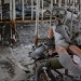 A doll in a children's gas mask is seen amongst beds at a kindergarten in the abandoned city of Pripyat near the Chernobyl nuclear power plant in Ukraine March 28, 2016.  REUTERS/Gleb Garanich - RTSCKBX