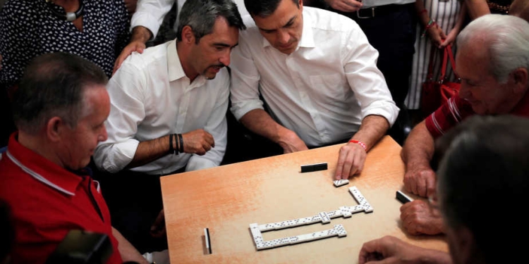 Socialist party (PSOE) leader Pedro Sanchez (3rd L) plays dominoes with pensioners at "Anica Torres" seniors centre while campaigning for Spain's upcoming general election in Benalmadena, southern Spain, June 15, 2016. REUTERS/Jon Nazca - RTX2GEEN
