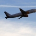 A Vueling aircraft flies at Barcelona's airport January 30, 2012. The low cost airline Vueling announced Monday an increase in capacity for the summer season incorporating 33 new flights and frequencies operated and opened five new routes.    REUTERS/Gustau Nacarino (SPAIN - Tags: TRANSPORT BUSINESS) - RTR2X39U