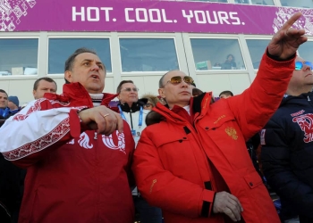 Russian President Vladimir Putin (C) and Sports Minister Vitaly Mutko (L) watch the cross country skiing men's relay during the Sochi 2014 Olympic Winter Games at Laura Cross-Country Ski and Biathlon Center near Krasnaya Polyana, Russia, February 16, 2014. To match story SPORT-DOPING/RUSSIA-MUTKO Sputnik/Kremlin/Mikhail Klimentyev/via REUTERS/File Photo ATTENTION EDITORS - THIS IMAGE WAS PROVIDED BY A THIRD PARTY. EDITORIAL USE ONLY.     TPX IMAGES OF THE DAY      - RTSIZP8