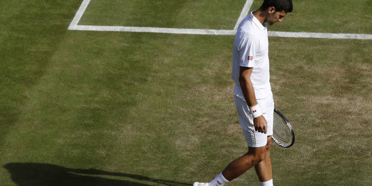Britain Tennis - Wimbledon - All England Lawn Tennis & Croquet Club, Wimbledon, England - 2/7/16 Serbia's Novak Djokovic reacts after losing his match against USA's Sam Querrey REUTERS/Stefan Wermuth - RTX2JDXS