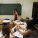 A teacher speaks to Spanish students during a German language class at an academy in Madrid May 18, 2012. A European Union survey in 2005 found the majority of Spaniards had not learned a second language: even those who wanted to improve their language skills did not make German their top choice, but preferred English and French. After France and the United Kingdom, Germany was the third most popular destination in Europe for Spanish migrants in 2011. Picture taken May 18, 2012.   To match Insight EUROPE/LABOUR        REUTERS/Andrea Comas (SPAIN - Tags: EDUCATION SOCIETY) - RTR32V5M