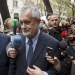 Former Andalusian regional President Jose Antonio Grinan is surrounded by reporters outside the Supreme Court in Madrid, April 9, 2015. Grinan was questioned on charges in one of the largest corruption cases disclosed in Spain in recent years involving alleged fraud in the allocation of public funds for labour regulation plans.  REUTERS/Juan Medina - RTR4WOOV