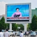 North Koreans walk past near a huge screen broadcasting the government's announcement on North Korea's fifth nuclear test in Pyongyang, North Korea, in this photo released by Kyodo September 9, 2016. Mandatory credit Kyodo/via REUTERS ATTENTION EDITORS - THIS IMAGE WAS PROVIDED BY A THIRD PARTY. EDITORIAL USE ONLY. MANDATORY CREDIT. JAPAN OUT. NO COMMERCIAL OR EDITORIAL SALES IN JAPAN. - RTX2ORUM