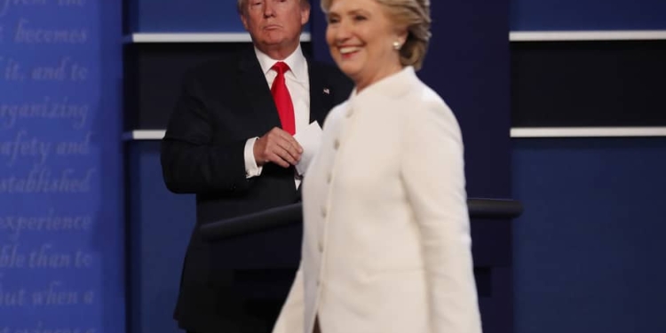 Republican U.S. presidential nominee Donald Trump and Democratic U.S. presidential nominee Hillary Clinton finish their third and final 2016 presidential campaign debate at UNLV in Las Vegas, Nevada, U.S., October 19, 2016.      REUTERS/Mike Blake   - RTX2PMBJ