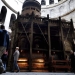Christian worshippers walk past the Tomb of Christ, where according to Christian belief the body of Jesus was laid after his death, inside the Church of the Holy Sepulchre in the Jerusalem's Old City, on March 23, 2016. 
The Churches of the Holy Land announced they will begin the restoration of the seriously dilapitated Tomb of Christ, in the Church of the Holy Sepulchre in Jerusalem in a few weeks. / AFP / THOMAS COEX