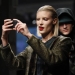 A model takes a photo with a smart phone as she presents a creation from the Kenneth Cole Autumn/Winter 2013 collection during New York Fashion Week in New York, February 7, 2013. REUTERS/Carlo Allegri  (UNITED STATES - Tags: FASHION) - RTR3DHHH