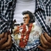 An Elvis Presley fan shows his T-shirt at the four-day Collingwood Elvis Festival in Collingwood, Ontario July 25, 2015. REUTERS/Chris Helgren