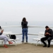 People use mobile phones on the pier at Orlowo beach in Gdynia, Poland September 10, 2016. REUTERS/Radu Sigheti