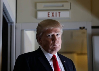 U.S. President Donald Trump pauses as he talks to journalists who are members of the White house travel pool on board Air Force One during his flight to Palm Beach, Florida while over South Carolina, U.S., February 3, 2017. REUTERS/Carlos Barria     TPX IMAGES OF THE DAY - RTX2ZK2C