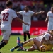 Villarreal's Russian midfielder Denis Cheryshev (bottom R) vies with Sevilla's midfielder Vitolo (bottom L) during the Spanish league football match Sevilla FC vs Villarreal CF at the Ramon Sanchez Pizjuan stadium in Sevilla on February 5, 2017. / AFP PHOTO / JORGE GUERRERO