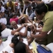 Members of the 'Ladies in White' dissident group shout as they are surrounded by police and government supporters after police broke up the group's regular march, detaining about 50 people, hours before U.S. President Barack Obama arrives for a historic visit, in Havana, March 20, 2016. REUTERS/Ueslei Marcelino