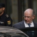 Rodrigo Rato leaves the High Court after being questioned by a judge investigating the alleged use of Caja Madrid credit cards for personal expenses in Madrid October 16, 2014.  REUTERS/Susana Vera