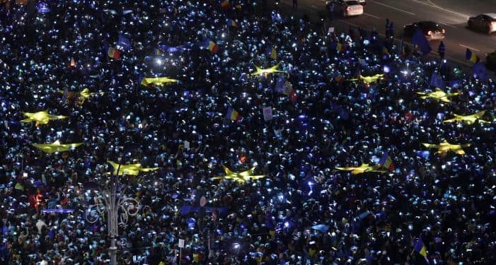 Romanians light up blue pieces of paper and pieces of yellow star shaped fabric thus forming the European Union flag during a protest against the government, in Bucharest, Romania, February 26, 2017. Inquam Photos/Octav Ganea/via REUTERS