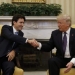 Canadian Prime Minister Justin Trudeau (L) shakes hands with U.S. President Donald Trump in the Oval Office at the White House in Washington, U.S., February 13, 2017.  REUTERS/Kevin Lamarque