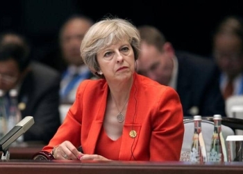 Britain's Prime Minister Theresa May listens to the speech of China's President Xi Jinping during the opening ceremony of the G20 Summit in Hangzhou, China, September 4, 2016. REUTERS/Nicolas Asfonri/Pool