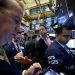 Traders work on the floor of the New York Stock Exchange (NYSE) as the Dow Jones Industrial Average passes the 20,000 mark shortly after the opening of the trading session in New York, U.S., January 25, 2017. REUTERS/Brendan McDermid