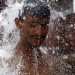 A man bathes in natural hot spring water in a cave in the town of Damt, Dali province in southern Yemen July 31, 2013. The natural baths are popular in Yemen due to their therapeutic benefits. REUTERS/Mohamed al-Sayaghi (YEMEN - Tags: HEALTH SOCIETY TRAVEL) - RTX126CX