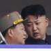 North Korean leader Kim Jong-un speaks to Choe Ryong-hae (L), director of the General Political Bureau of the Korean People's Army (KPA), during a parade to commemorate the 60th anniversary of the signing of a truce in the 1950-1953 Korean War, at Kim Il-sung Square in Pyongyang July 27, 2013. REUTERS/Jason Lee