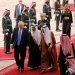 Saudi Arabia's King Salman bin Abdulaziz Al Saud (C, in brown and white) welcomes U.S. President Donald Trump (L) and first lady Melania Trump (top, 3-R) with a military honor cordon after they arrived aboard Air Force One at King Khalid International Airport in Riyadh, Saudi Arabia May 20, 2017. REUTERS/Jonathan Ernst - RTX36OSG