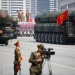 Intercontinental ballistic missiles (ICBM) are driven past the stand with North Korean leader Kim Jong Un and other high ranking officials during a military parade marking the 105th birth anniversary of country's founding father Kim Il Sung, in Pyongyang April 15, 2017. The missiles themselves were shown for the first time inside a new kind of canister-based launcher on Saturday. The trucks upon which they are mounted are originally designed to move lumber. REUTERS/Damir Sagolj SEARCH "PARADE WID" FOR THIS STORY. SEARCH "WIDER IMAGE" FOR ALL STORIES. - RTS12G48