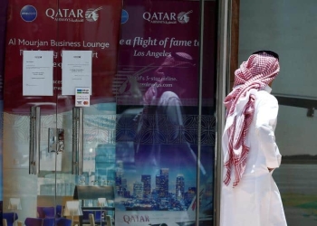 A man walks past Qatar Airways office in Riyadh, Saudi Arabia, June 5, 2017. REUTERS/Faisal Al Nasser