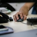 A specialist of IT company Infopulse uses a computer mouse in his office in Kiev, Ukraine, June 13, 2017. Picture taken June 13, 2017.  REUTERS/Gleb Garanich