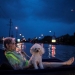 A rescue helicopter hovers in the background as an elderly woman and her poodle use an air mattress to float above flood waters from Tropical Storm Harvey while waiting to be rescued from Scarsdale Boulevard in Houston, Texas. REUTERS/Adrees Latif