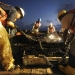 Crew members from Marine Vessel Braxton Perry recover a deflection boom after three days of controlled burns in the Gulf of Mexico in this May 7, 2010 photograph. The U.S. Coast Guard working in partnership with BP PLC, local residents, and other federal agencies is conducting "in situ burning" to aid in preventing the spread of oil following the April 20 explosion on Mobile Offshore Drilling Unit Deepwater Horizon. Picture taken on May 7, 2010.     REUTERS/Justin Stumberg/U.S. Navy photo/Handout    (UNITED STATES - Tags: ENVIRONMENT DISASTER) FOR EDITORIAL USE ONLY. NOT FOR SALE FOR MARKETING OR ADVERTISING CAMPAIGNS - RTR2DMXF