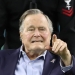 FILE PHOTO: Former U.S. President George H.W. Bush arrives on the field to do the coin toss ahead of the start of Super Bowl LI between the New England Patriots and the Atlanta Falcons in Houston, Texas, U.S., February 5, 2017. REUTERS/Adrees Latif