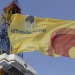 A flag with the logo of Rosneft company flies next to an oil derrick at Suzunskoye oil field north from Krasnoyarsk, Russia, in this March 26, 2015 file photo. Russian state oil producer Rosneft ROSN.MM will be forced to postpone drilling a second well in the Kara Sea for at least two more years, three sources told Reuters, as a result of Western sanctions over the Ukraine crisis. To match Exclusive RUSSIA-ROSNEFT/KARA-SEA   REUTERS/Sergei Karpukhin/Files