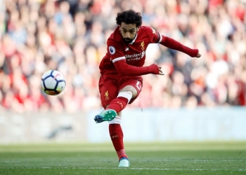 Soccer Football - Premier League - Liverpool vs AFC Bournemouth - Anfield, Liverpool, Britain - April 14, 2018   Liverpool's Mohamed Salah shoots at goal    Action Images via Reuters/Carl Recine    EDITORIAL USE ONLY. No use with unauthorized audio, video, data, fixture lists, club/league logos or "live" services. Online in-match use limited to 75 images, no video emulation. No use in betting, games or single club/league/player publications.  Please contact your account representative for further details.