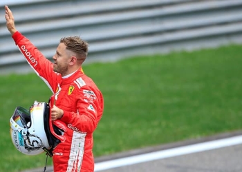 Formula One - F1 - Chinese Grand Prix - Shanghai, China - April 14, 2018 - Ferrari's Sebastian Vettel celebrates after setting pole position in qualifying. REUTERS/Aly Song