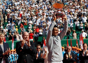 Tennis - ATP - Monte Carlo Masters - Monte-Carlo Country Club, Monte Carlo, Monaco - April 22, 2018   Spain's Rafael Nadal celebrates with the trophy after winning the final against Japan's Kei Nishikori as Princess Charlene of Monaco and Prince Albert II of Monaco applaud   REUTERS/Eric Gaillard