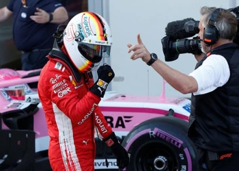 Formula One - F1 - Azerbaijan Grand Prix - Baku City Circuit, Baku, Azerbaijan - April 28, 2018   Ferrari's Sebastian Vettel celebrates winning the pole position   REUTERS/David Mdzinarishvili