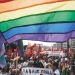 Gay rights activists take part in an opposition protest march in Moscow, June 12, 2013. Thousands of protesters marched in Moscow on Wednesday, calling for Russian President Vladimir Putin's resignation and the release of activists facing long jail terms over violence at a rally on the eve of his inauguration to a third term last year. Banner read, "Equal rights". REUTERS/Maxim Shemetov (RUSSIA - Tags: POLITICS CIVIL UNREST) - GM1E96C1E8E01