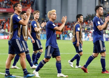 Soccer Football - World Cup - Group H - Japan vs Senegal - Ekaterinburg Arena, Yekaterinburg, Russia - June 24, 2018   Japan's Yuto Nagatomo and team mates after the match                                        REUTERS/Carlos Garcia Rawlins