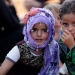 Niños sirios desplazados al arribar a un campamento de refugiados en la aldea de Atimah, provincia de Idlib, Siria.