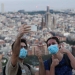 People wearing protective masks take a selfie, as the spread of the coronavirus disease (COVID-19) continues, in Barcelona, Spain May 6, 2020. REUTERS/Nacho Doce