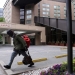 A member of the homeless community walks past a Hyatt hotel that is completely closed to guests during the coronavirus disease (COVID-19) outbreak, in Washington, U.S. May 8, 2020. New unemployment data shows the U.S. economy lost a staggering 20.5 million jobs in April. REUTERS/Jonathan Ernst