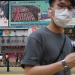 La gente pasa frente a una pantalla de televisión que muestra noticias sobre la aprobación de la ley de Seguridad Nacional de Hong Kong en Beijing, en Hong Kong, China, 28 de mayo de 2020. REUTERS / Tyrone Siu