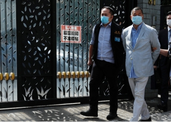 Media mogul Jimmy Lai Chee-ying, founder of Apple Daily (C) is detained by the national security unit in Hong Kong, China August 10, 2020. REUTERS/Tyrone Siu